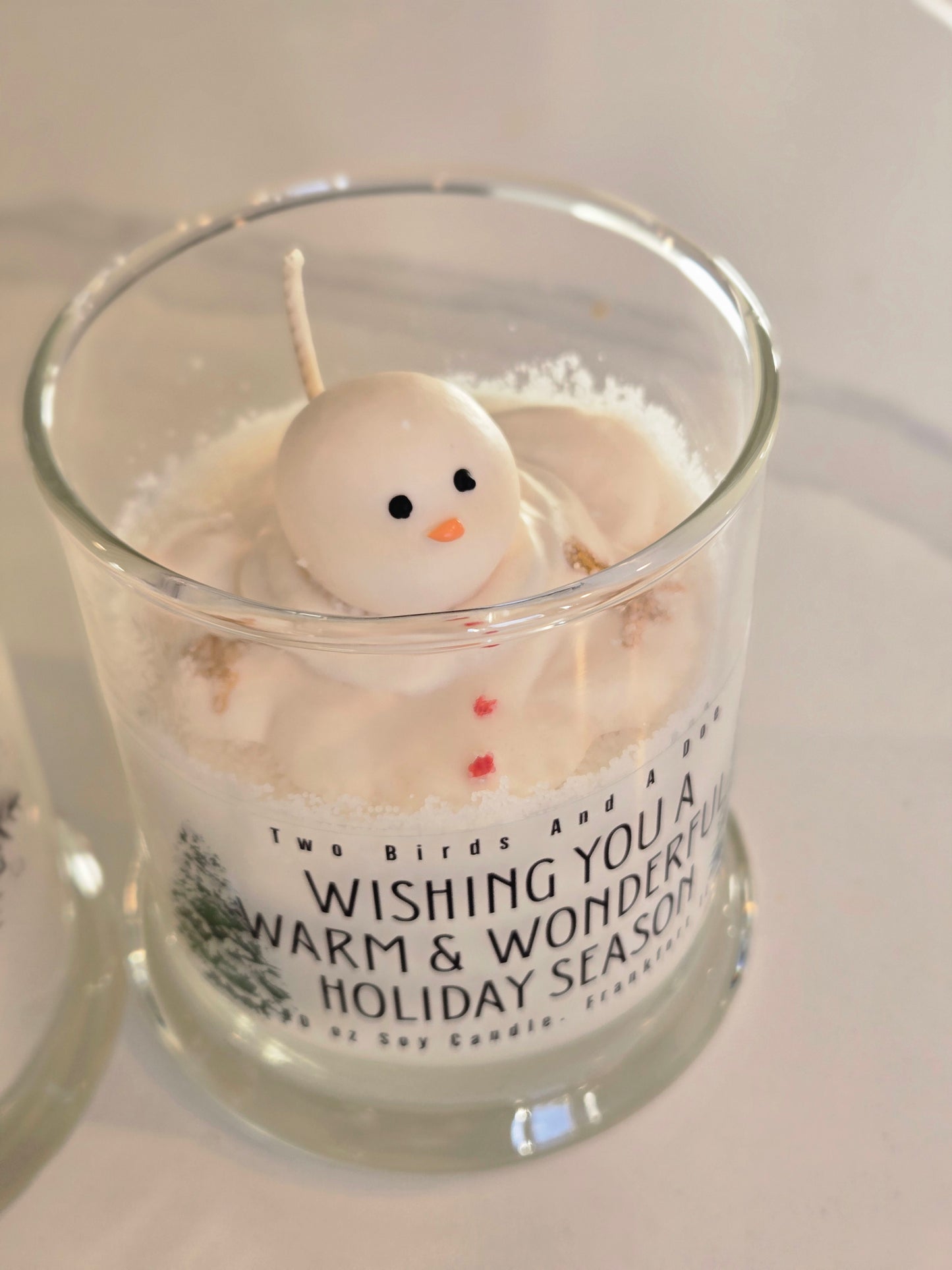 Melted snowman candle